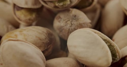 Macro Shot of Crunchy Pistachios Rotating in Studio