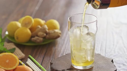 Refreshing Lemonade Beverage Being Poured into Glass