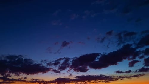 Time-Lapse of Clouds at a Colorful Sunset