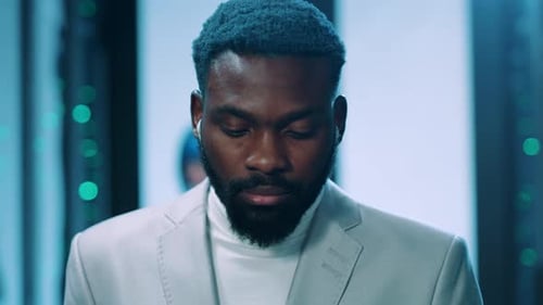 Serious Man Close Up in Tech Environment