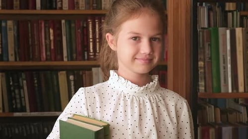 Portrait of Kid Girl with Books in Old Library Close Up Schoolgirl Selecting Literature for Reading