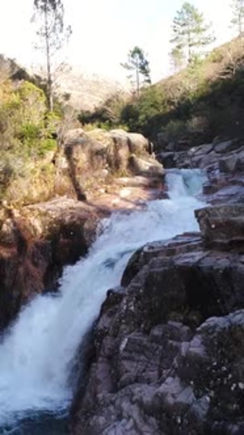 Vertical Video of Beautiful Mountain River with Cascades Flowing on Rocks