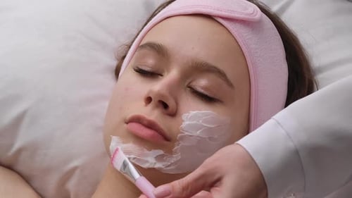 Young Woman Receives Facial at Beauty Clinic