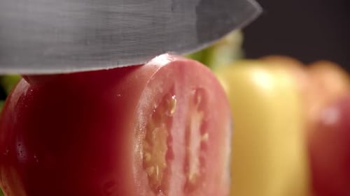 Slicing a Fresh Tomato with Sharp Knife