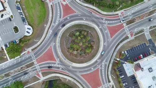 Top View of City Street Traffic on Roundabout Intersection with Moving Cars Viev From Above of Urban