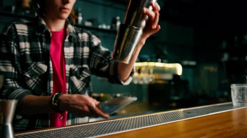 Bartender Making a Cocktail at the Bar