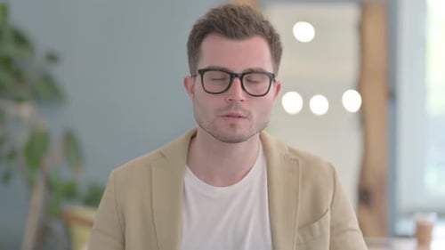 Portrait of Brainstorming Young Businessman with New Idea