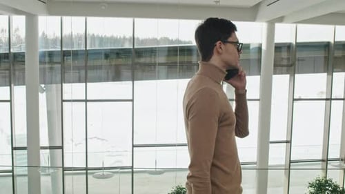 Manager Talking with Colleague on the Phone