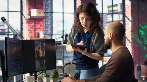 Man and Woman Collaborate on Content Creation for the Media Industry