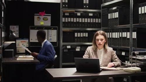 Office Workers Working at Desks in Corporate Setting