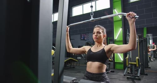 Trx Fitness Machine in the Gym Cropped View of the Active Calm Strong Women Training Arms in