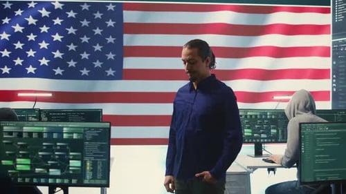 Man With American Flag in Technology Office