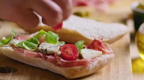 Preparing a Delicious Open-faced Sandwich with Fresh Ingredients