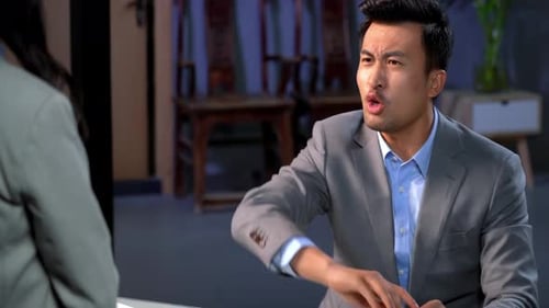 Man Arguing Over Documents in Office Meeting