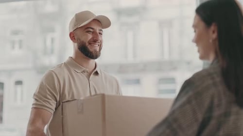 Delivery Man Hands Box to Woman