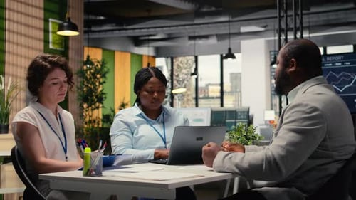 Diverse Recruiters Evaluating an Applicant CV Resume During Interview Session