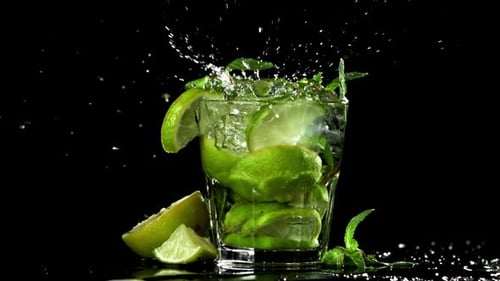 Ice Falls Into a Mojito Cocktail Filmed on a Highspeed Camera at 1000 Fps
