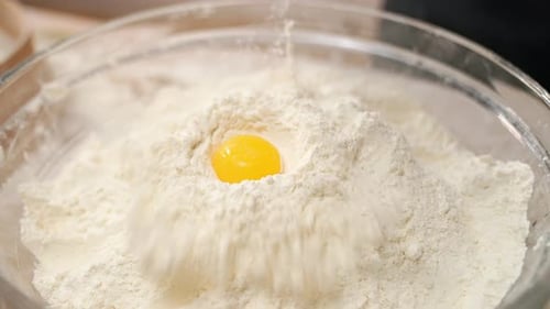Egg Falls Into Flour Container