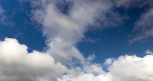 Clouds Drifting Across a Blue Sky