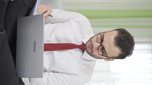 Young Adult Male Working at a Computer