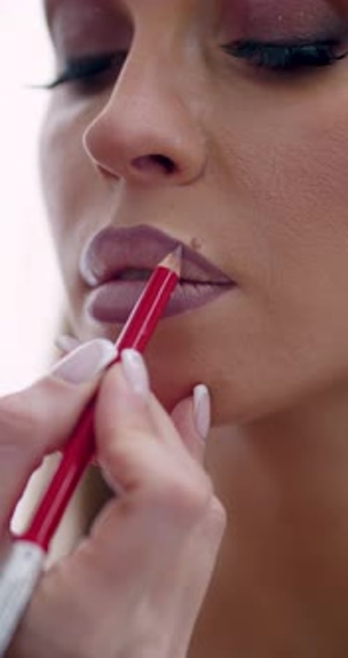 Woman Having Lip Liner Applied Close Up
