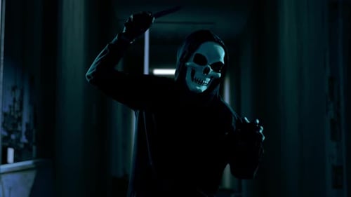 Hooded Figure in Skull Mask Waving Knife