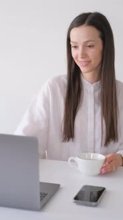 Young Business Woman Works at the Computer in the Office Vertical Video