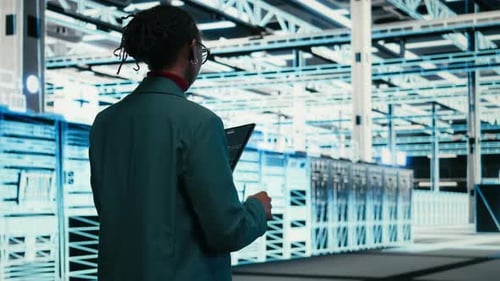 Writing Code Tablet and Female Programmer Walking in Data Center