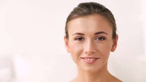 Smiling Woman Portrait with Neutral Background