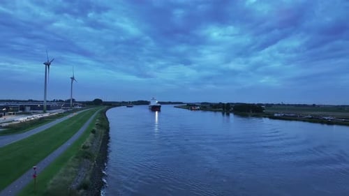 Aerial View Cargo Ship with Turbines at Night