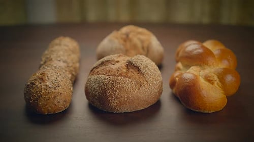 Close Up of Several Loaves of Bread on Table