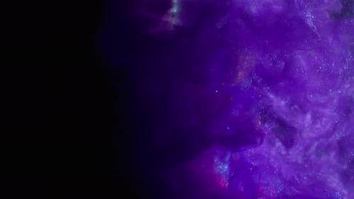 Swirling abstract purple glitter against black background