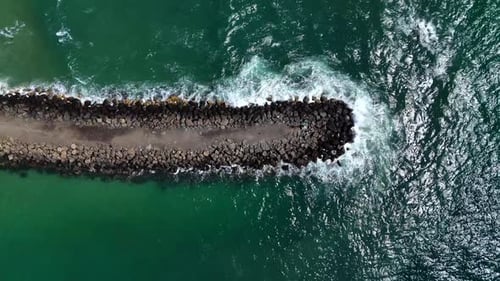 Top Down View of Ocean Passage and Breakwater Waves