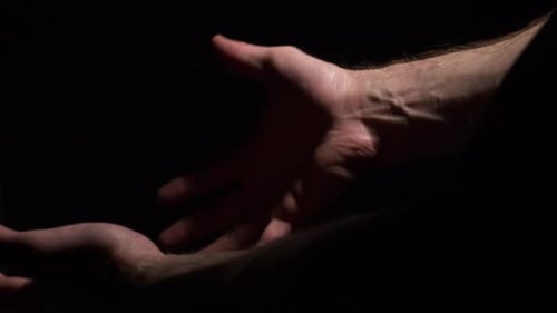 Chained Hands Struggle in the Darkness