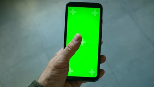 Hand Holding Smartphone with Green Screen and Tracking Markers