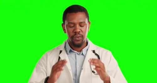 Stress, Migraine and male doctor in a studio with green screen for burnout or overworked