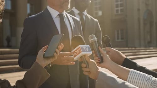 Anonymous Politician Talking to Mass Media on Steps of Government Office