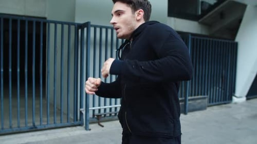 Closeup Sportsman Training Workout Outdoor. Fitness Man Running on Urban Street In