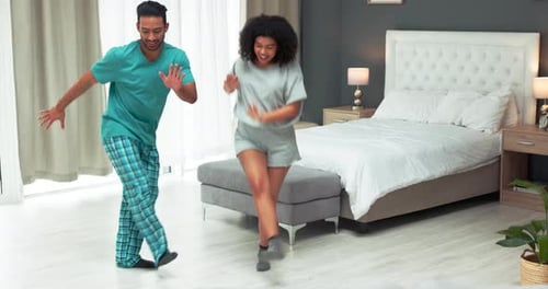 Couple Dancing Together in Their Bedroom