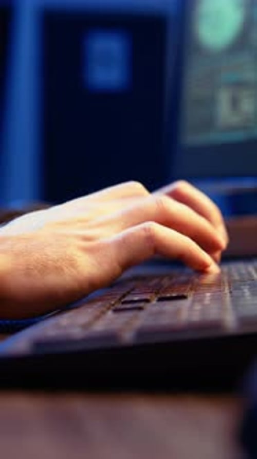 Vertical Video Hacker in Secret Underground Shelter Typing on Keyboard Close Up