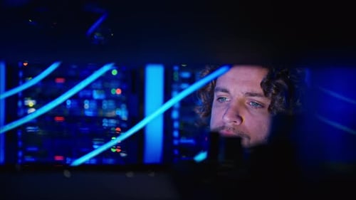 Man analysing servers in a data center