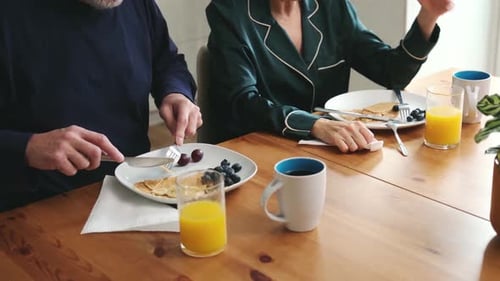 Senior couple eating a healthy breakfast together