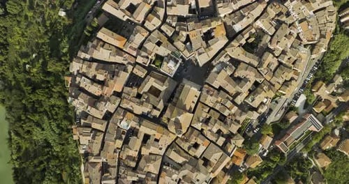 Aerial view of medieval rooftops and streets, Italy.