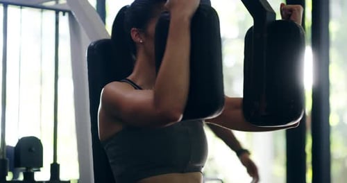 Woman Working Out On Chest Press Machine