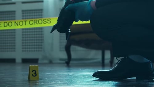 Investigator Photographs Evidence at Crime Scene Investigation