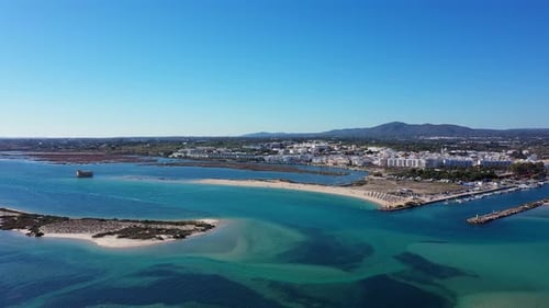 Aerial View of Fuseta Portugal Displaying the Blue Waters of Ria Formosa with Sandy Beaches a
