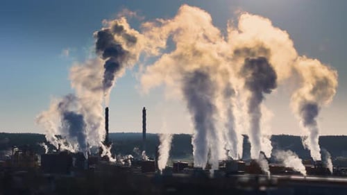 Ugly sight of factory chimneys causing air pollution by emitting gases