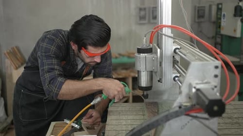 Carpenter is working at workshop.