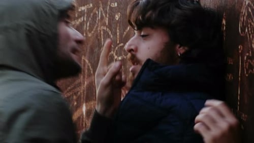 to waylay - young man hiding in the park waits and attacks a friend