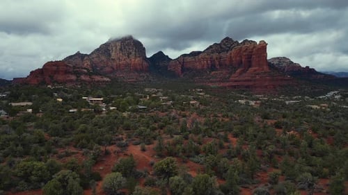 Aerial view sweeping right showing Capitol Butte Mountain in Sedona
